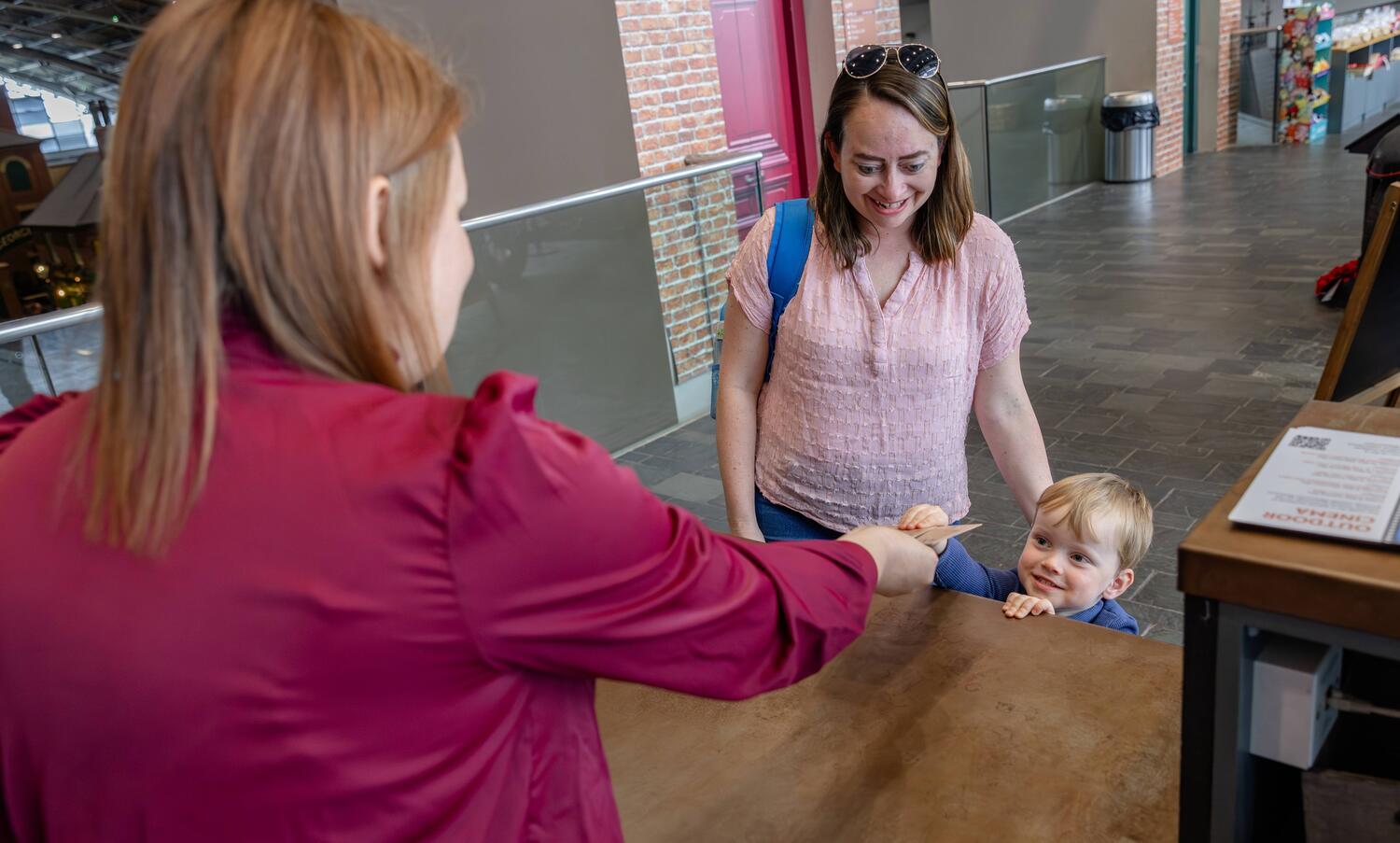 Mother and son buying a ticket