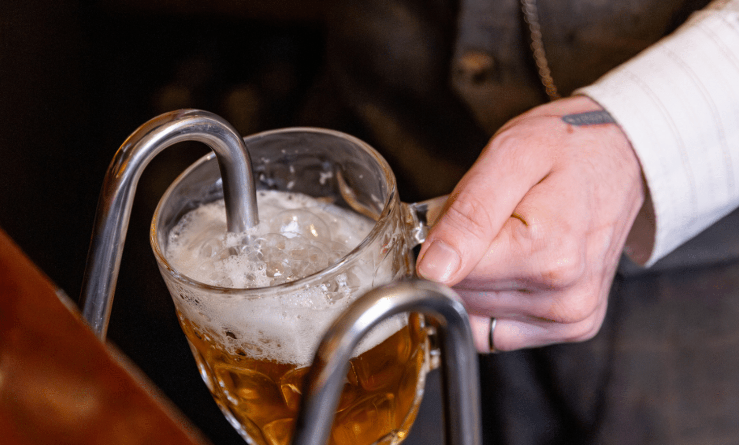 Man pouring a pint of beer