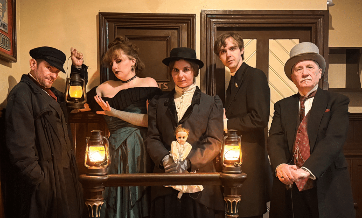 five characters in victorian dress looking sinister in an office