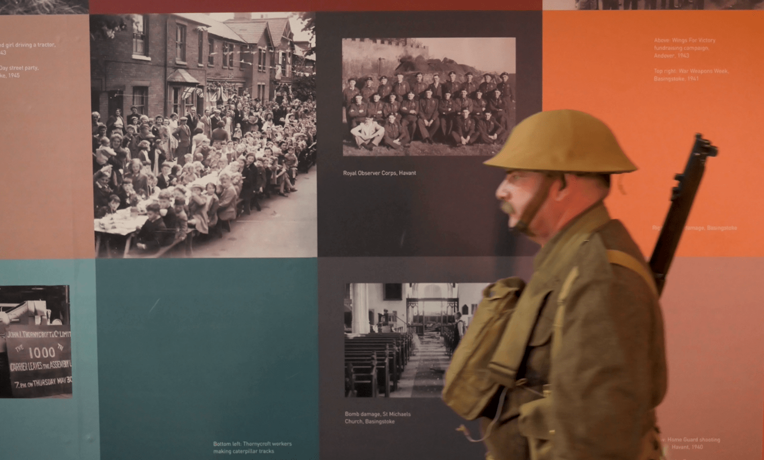 Soldier walking in front of memorial wall