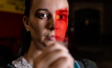 Biologist looking through blood sample