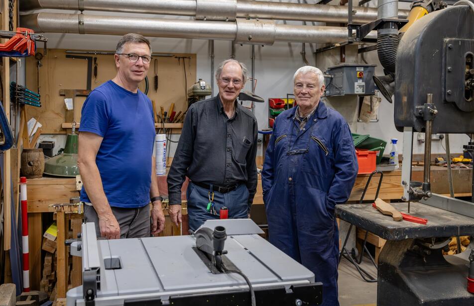 3 volunteer men in our workshop