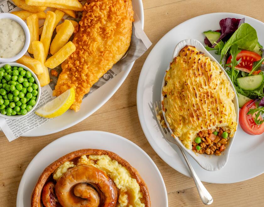 A mixture of meals, fish and chips, cottage pie and sausages and mash