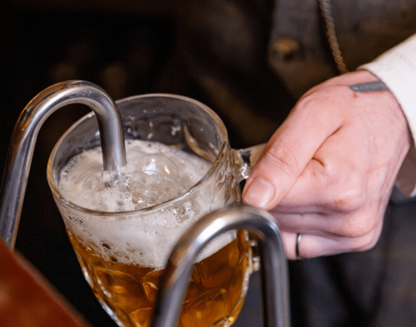 Man pouring a pint of beer